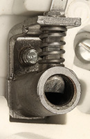 Tube socket contact with mechanism to fix plug pins